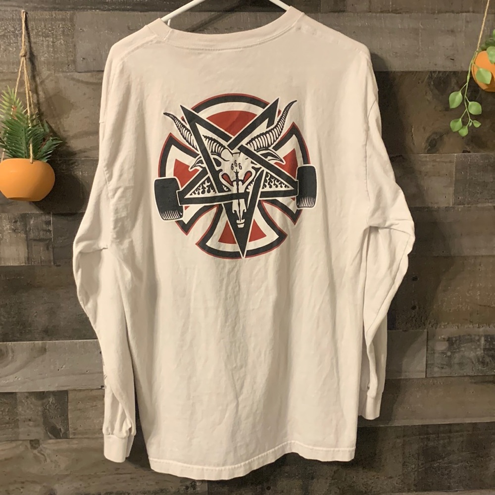 White independent long sleeve. Discoloration pictured.